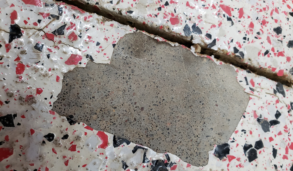 old coat of epoxy pealing of the floor