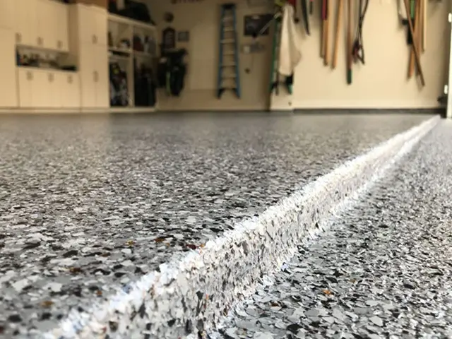 garage floor coated with epoxy and flakes